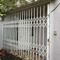  静岡県伊豆市修善寺の売買物件/サブ玄関を外側から。シャッターがついている
